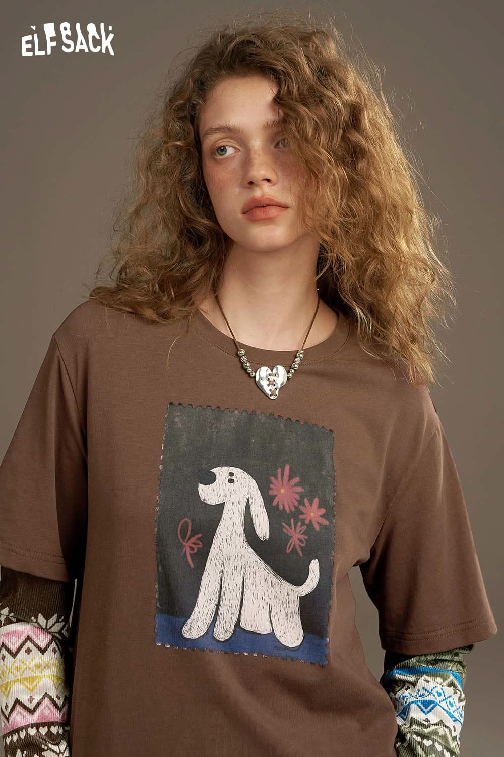 ELFSACK vintage print long sleeve t shirt with a playful dog design on a brown background