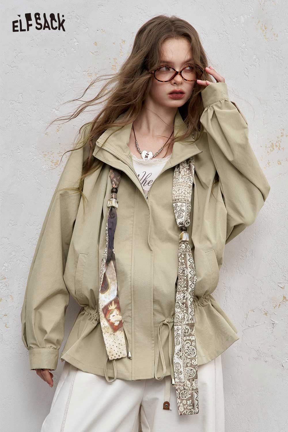 ELFSACK minimalist short jacket for women in beige with cinched waist and decorative straps