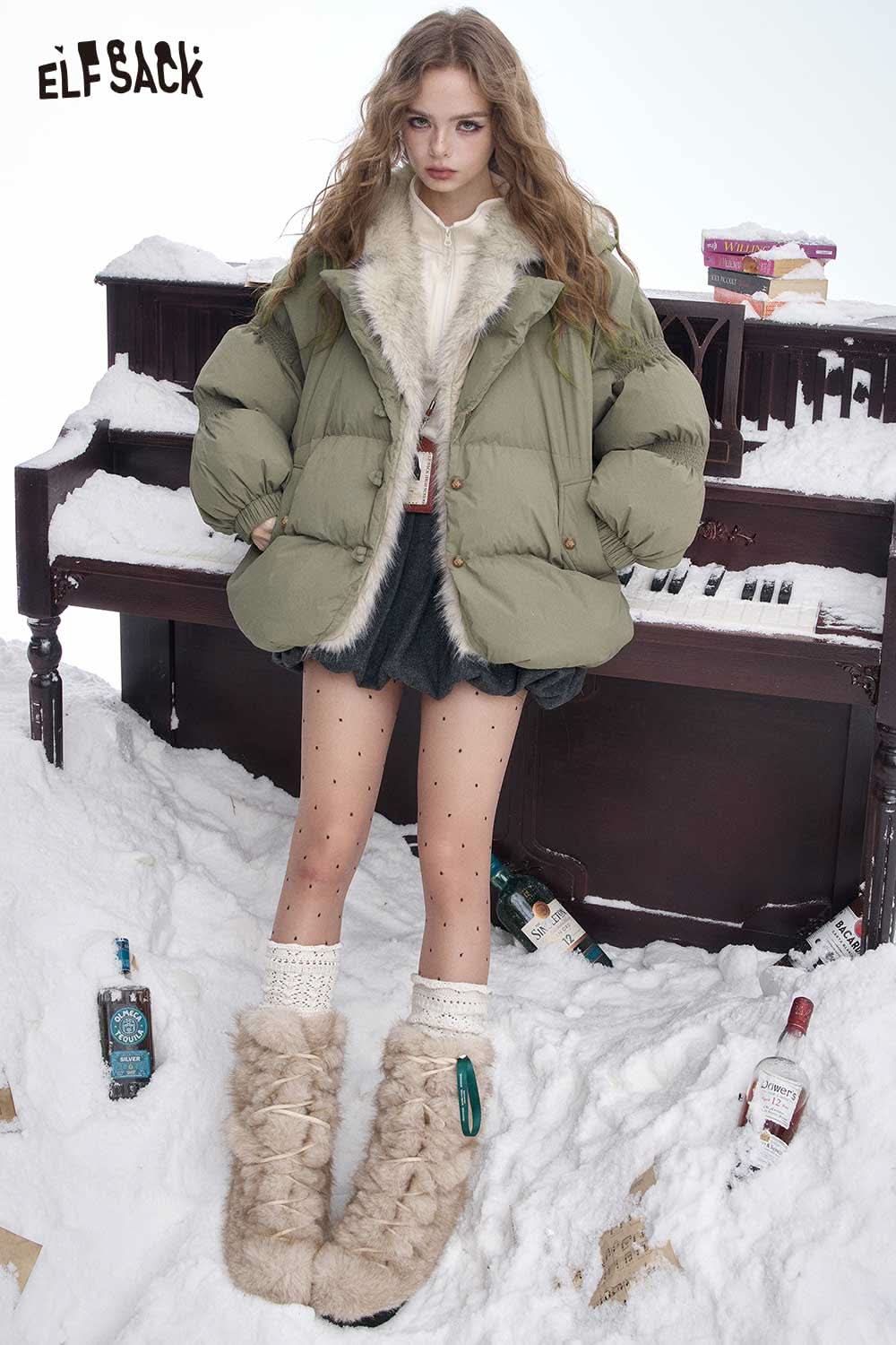 ELFSACK women's plush lined down jacket in olive green, paired with a stylish outfit in a snowy setting