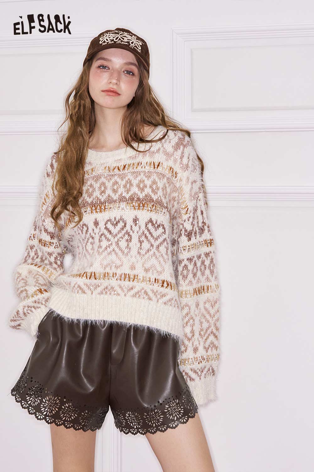 ELFSACK women's PU leather shorts with scalloped hem paired with a cozy patterned sweater