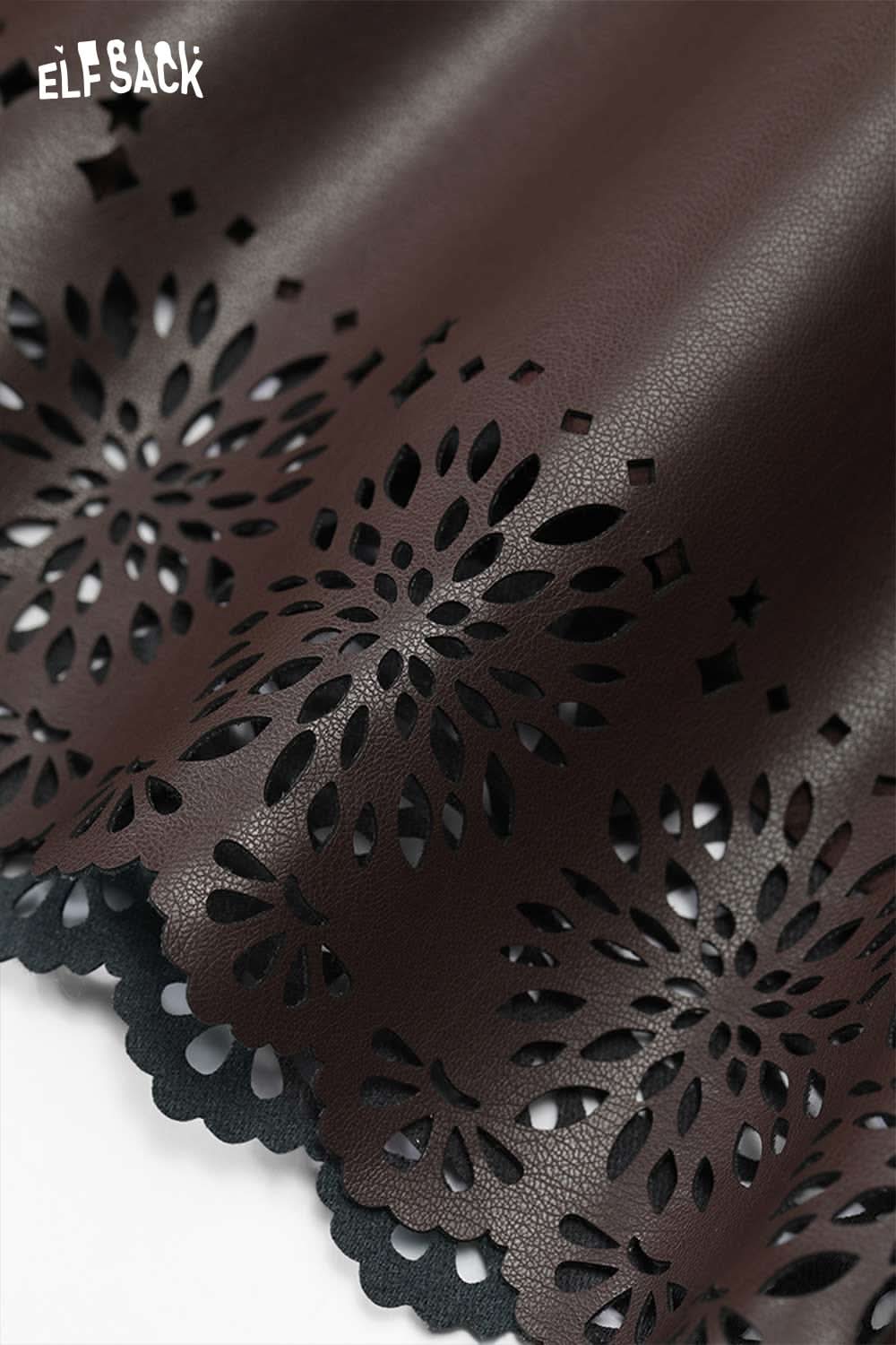 Detailed view of ELFSACK women's PU leather shorts with intricate cut-out designs for a stylish look