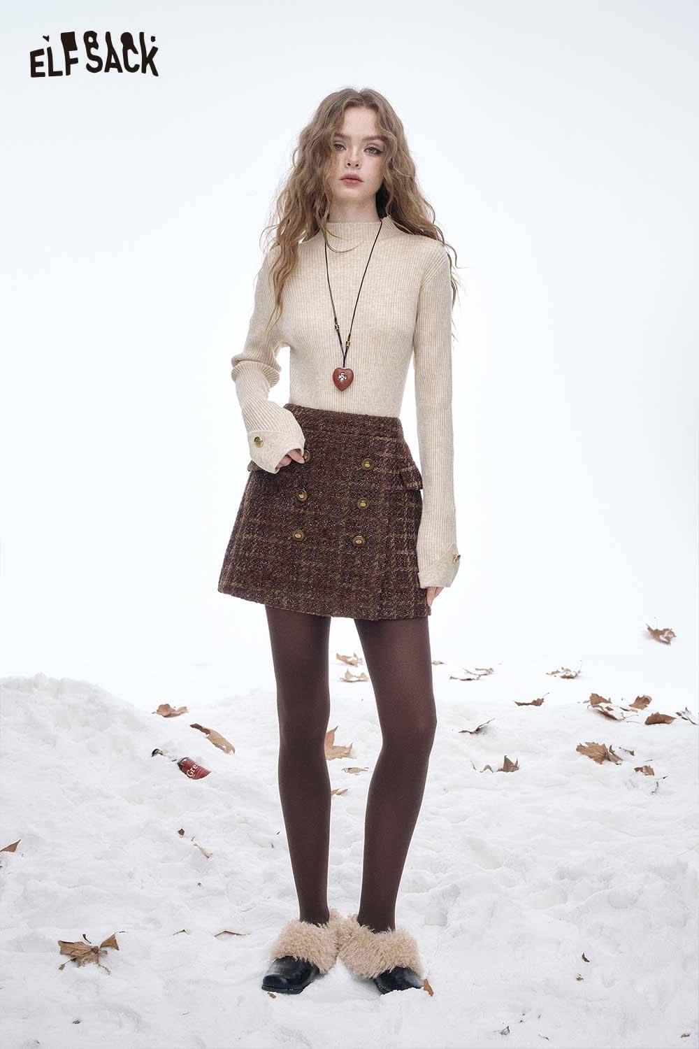 ELFSACK women's slim fit knit sweater in cream paired with a brown skirt and tights for a chic winter look