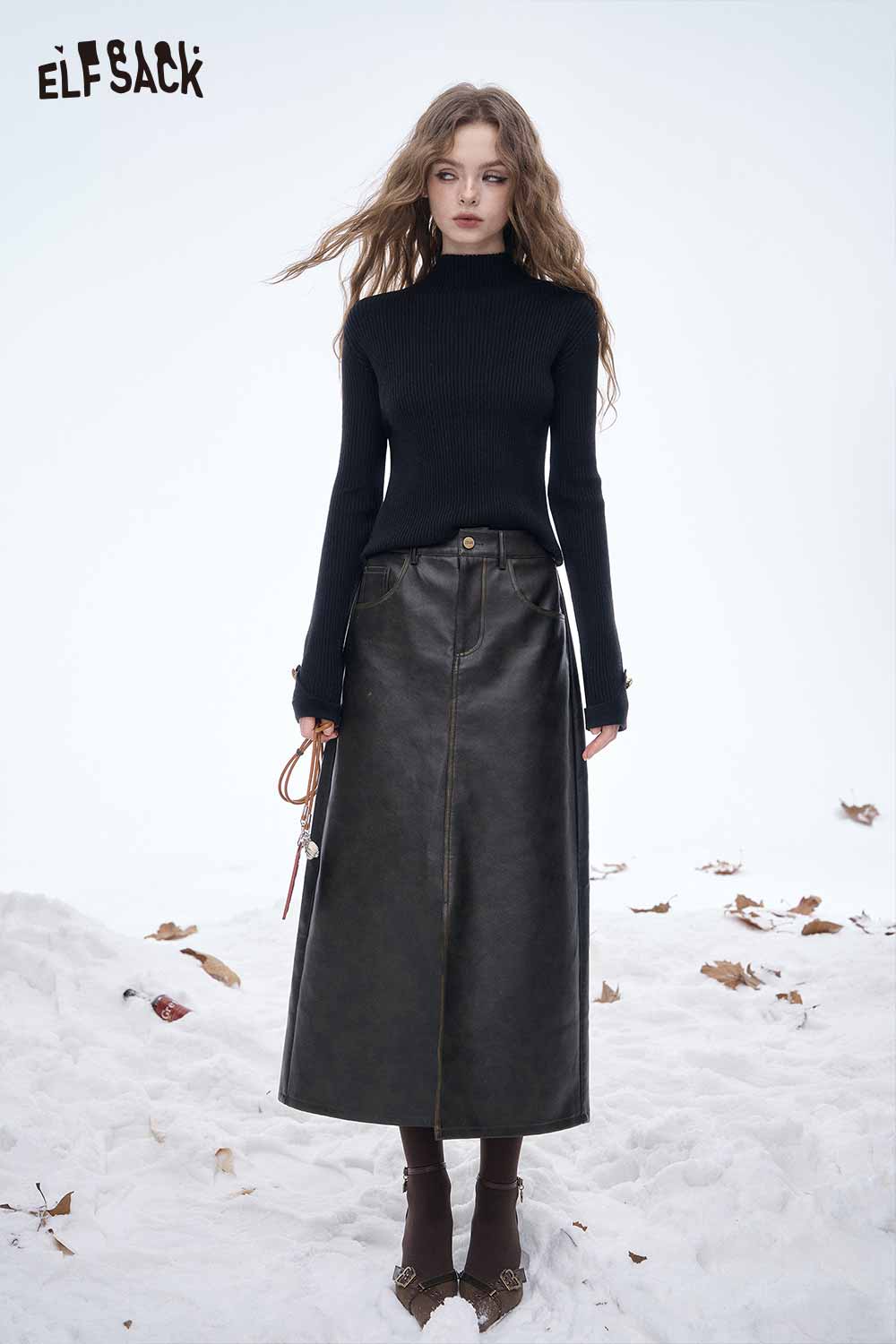 ELFSACK women's slim fit knit sweater in black paired with a leather midi skirt for a stylish winter look