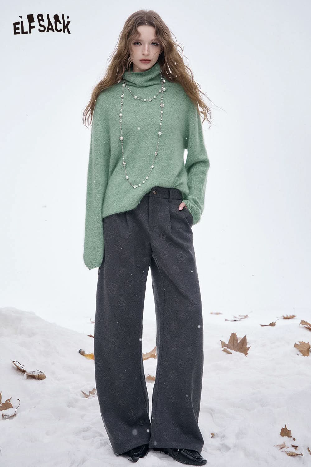 ELFSACK women's soft straight leg pants paired with a cozy green sweater in a winter setting