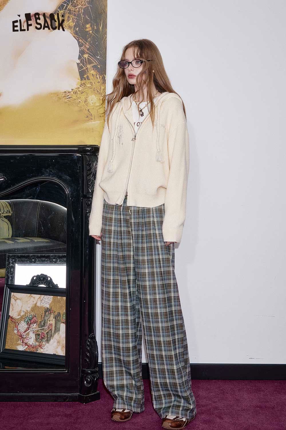ELFSACK women's check pattern relaxed fit trousers styled with a cozy zip-up hoodie in a chic setting