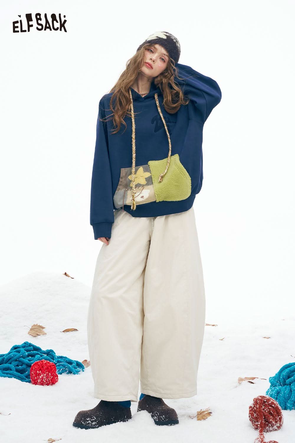 ELFSACK women's color block hooded sweatshirt with unique patch design and cozy fit for winter style