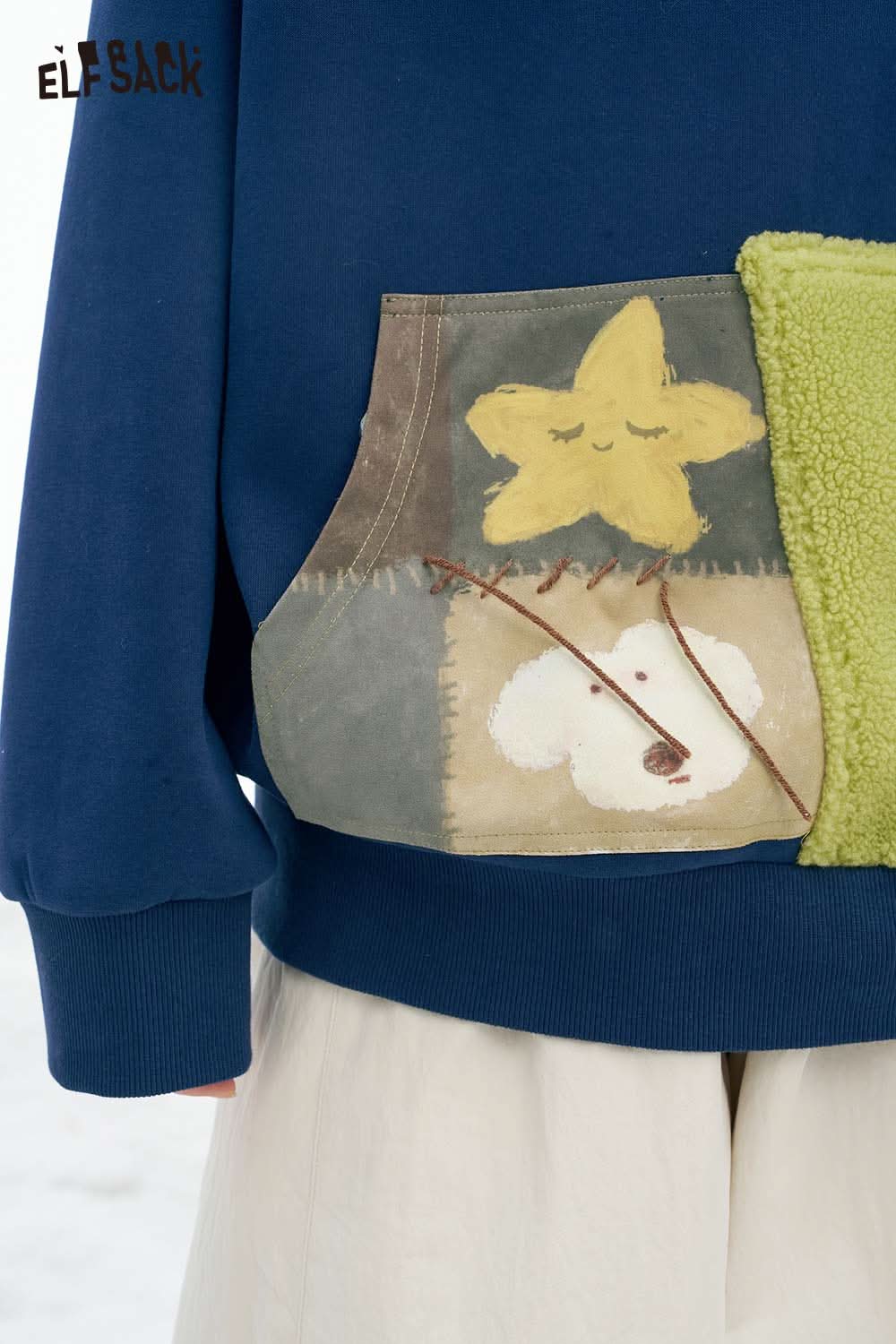 ELFSACK women's color block hooded sweatshirt with a unique patch pocket design and vibrant colors