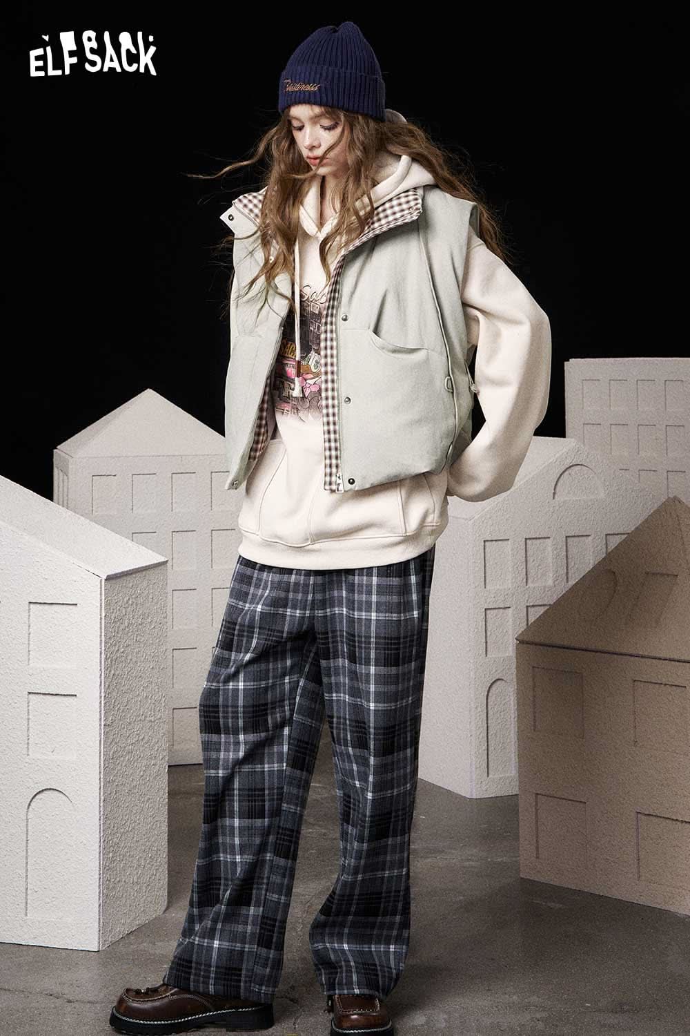Stylish ELFSACK women's cotton blend down vest paired with a cozy hoodie and plaid pants