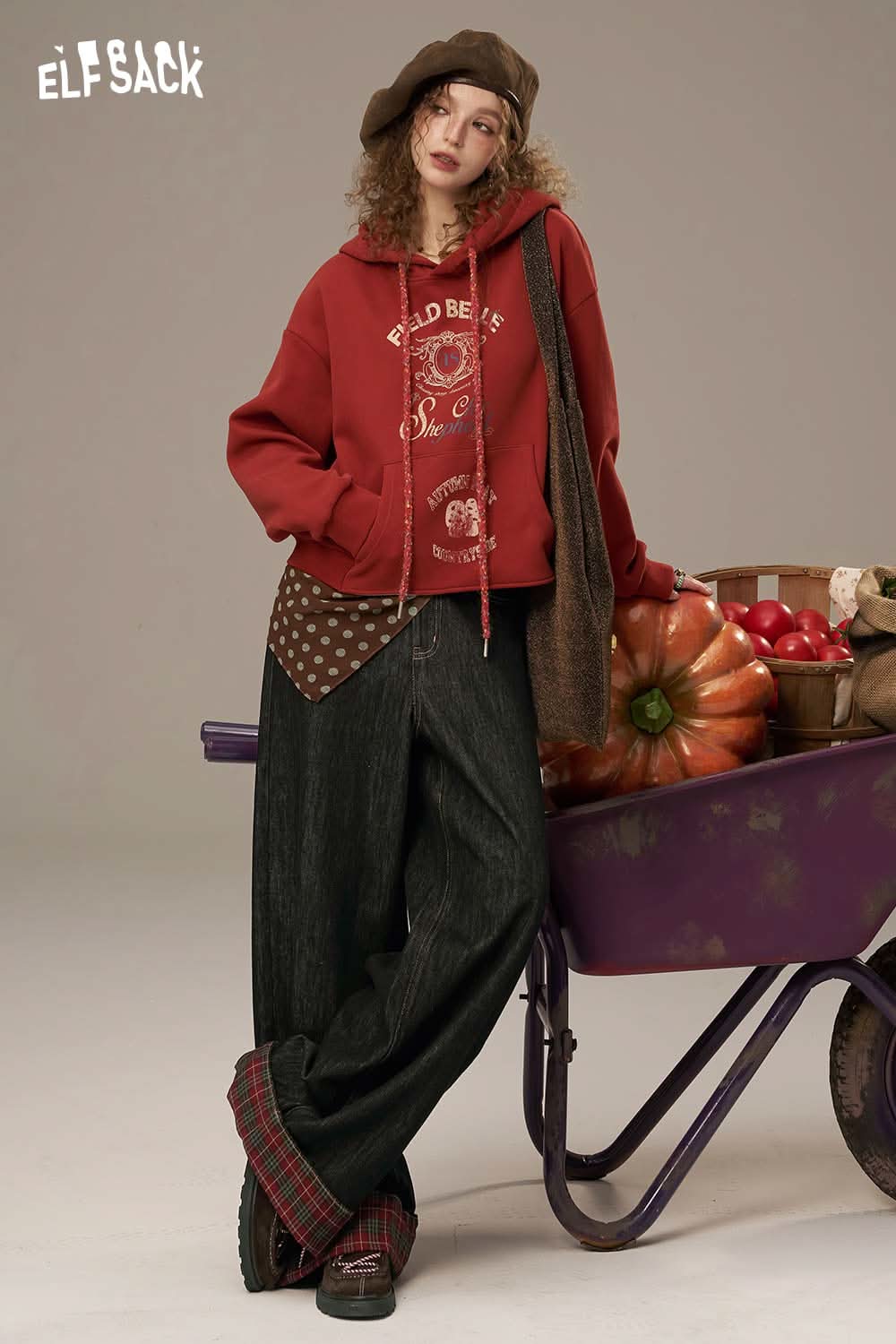 Fashionable ELFSACK women's denim splicing pants styled with a cozy hoodie and soft accessories