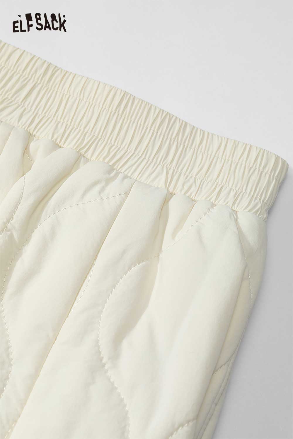Close-up of ELFSACK women's down half skirt featuring an elastic waistband and quilted design
