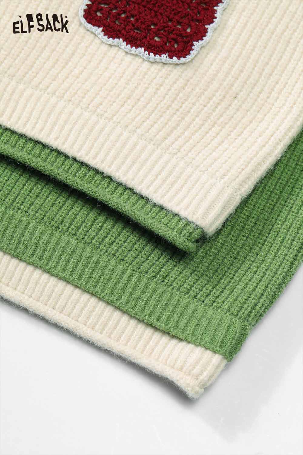 Close-up of ELFSACK women's embroidered stand collar sweater featuring a cream and green design.