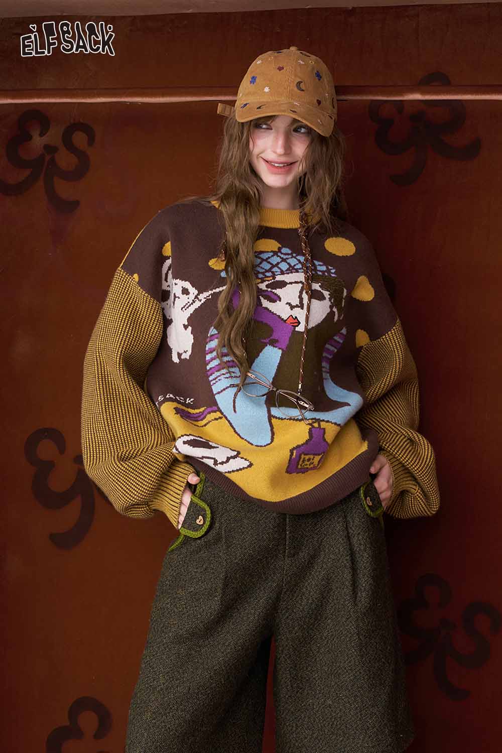 ELFSACK women's empire waist bermuda shorts paired with a colorful oversized sweater for a trendy look