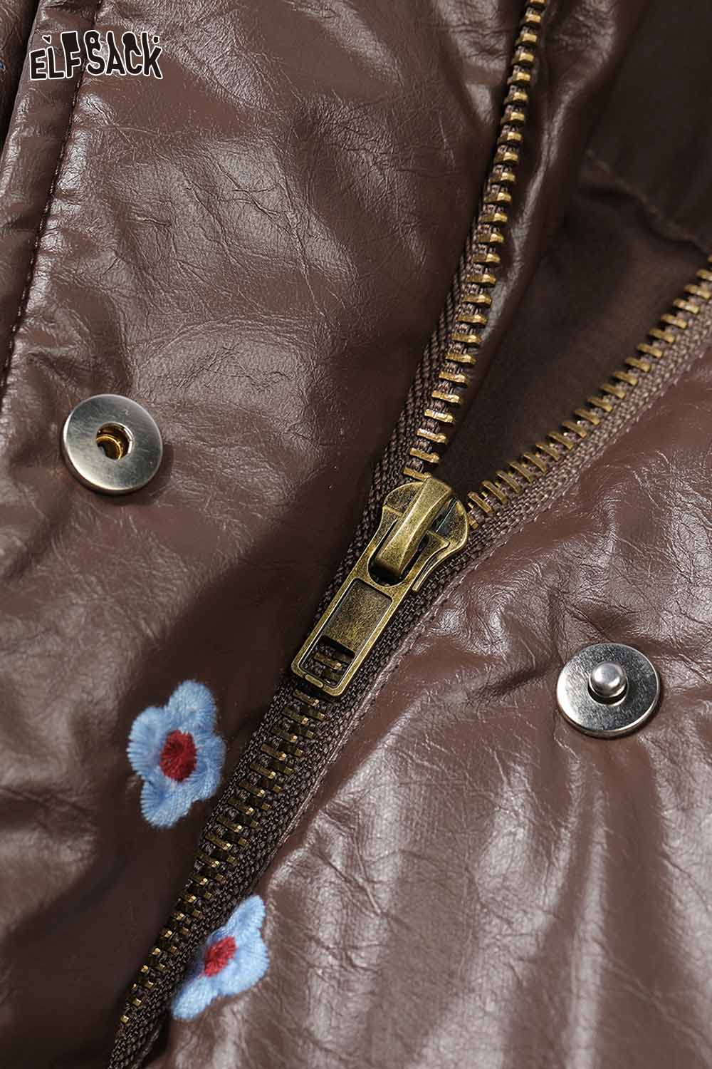Close-up of ELFSACK women's faux leather short down jacket showing zipper and floral embroidery detail