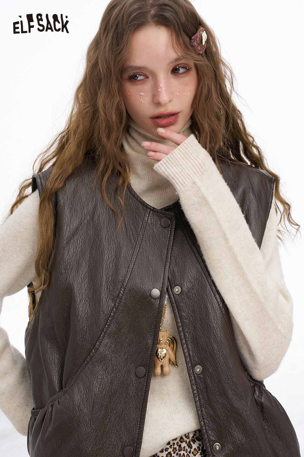 ELFSACK women's faux leather sleeveless jacket styled with a beige turtleneck for a trendy look