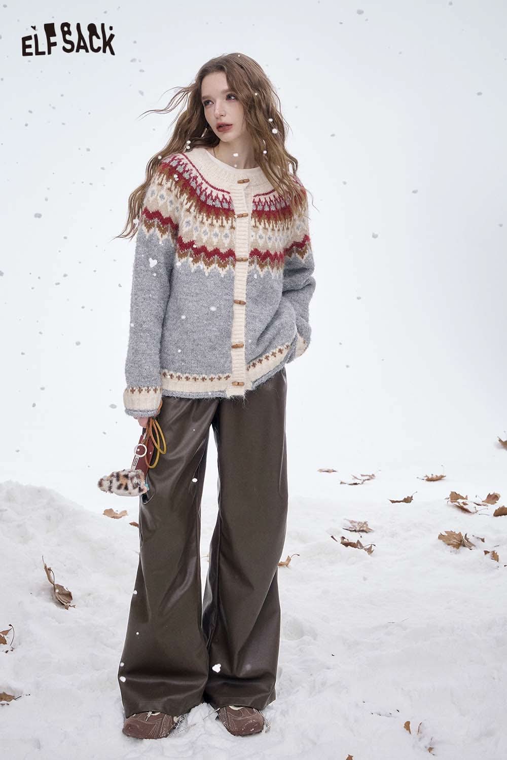 ELFSACK women's faux leather straight leg pants paired with a cozy sweater in a snowy outdoor setting