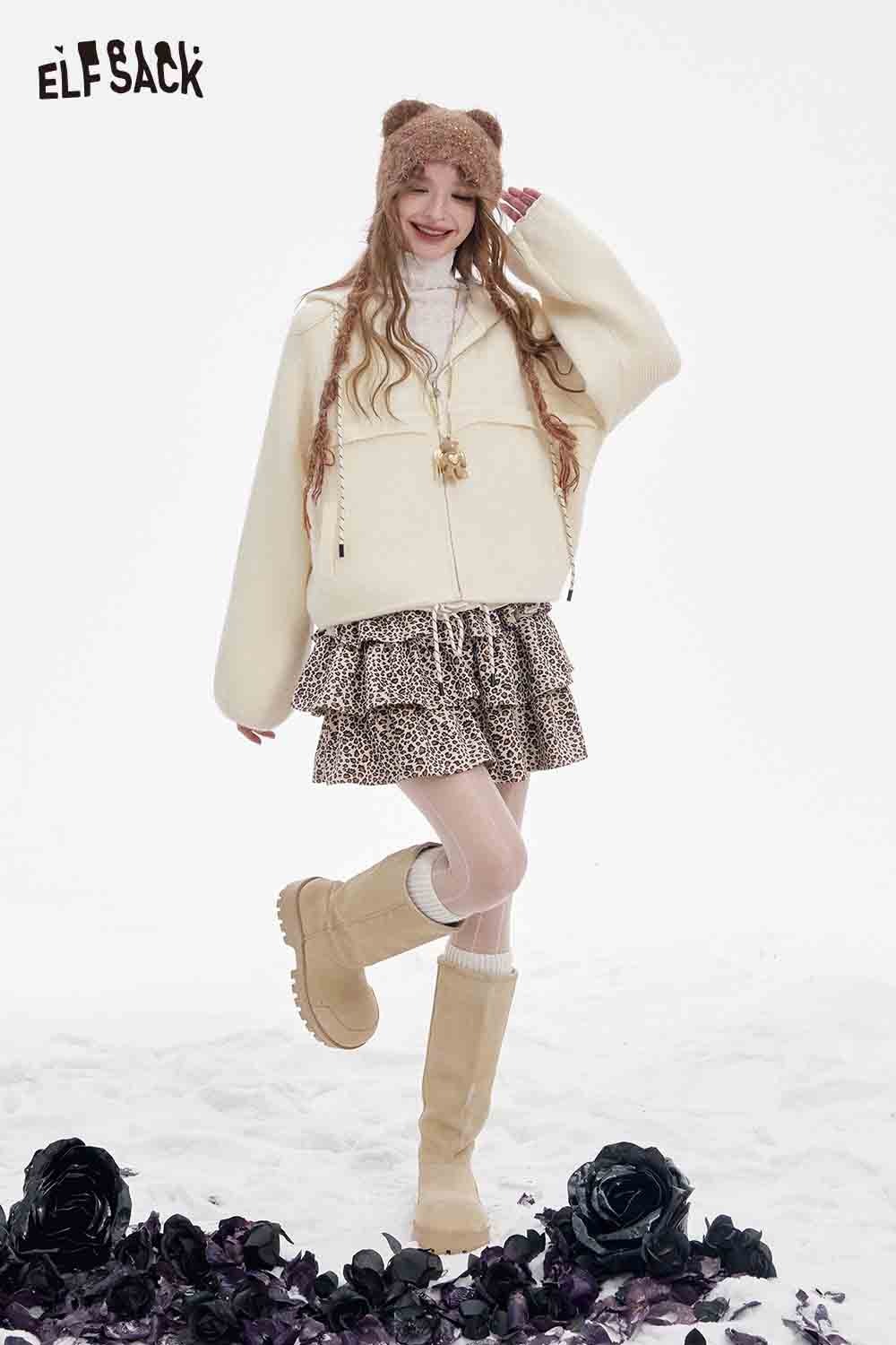 ELFSACK women's fleece hooded sweater in cream, styled with a leopard print skirt and knee-high boots