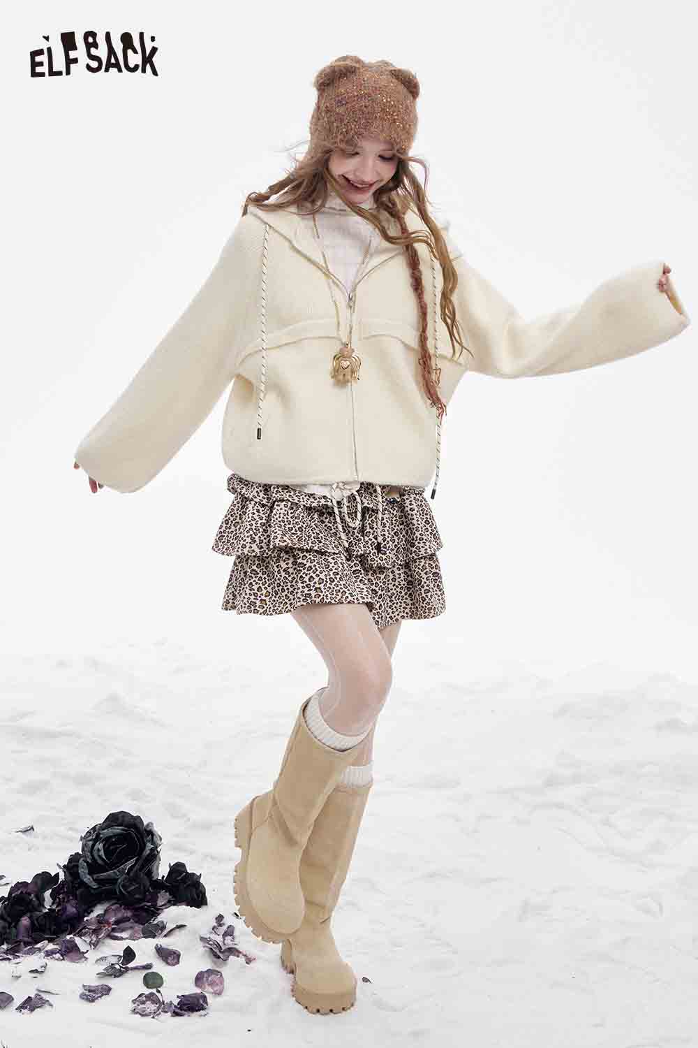 ELFSACK women's fleece hooded sweater in cream paired with a stylish skirt and boots for a cozy look