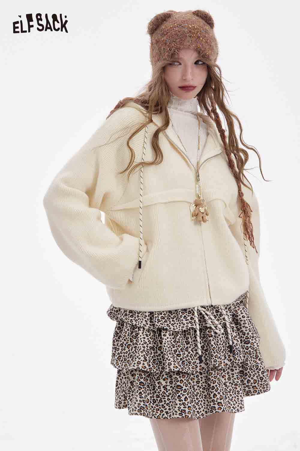 ELFSACK women's fleece hooded sweater in cream, styled with a ruffled leopard print skirt