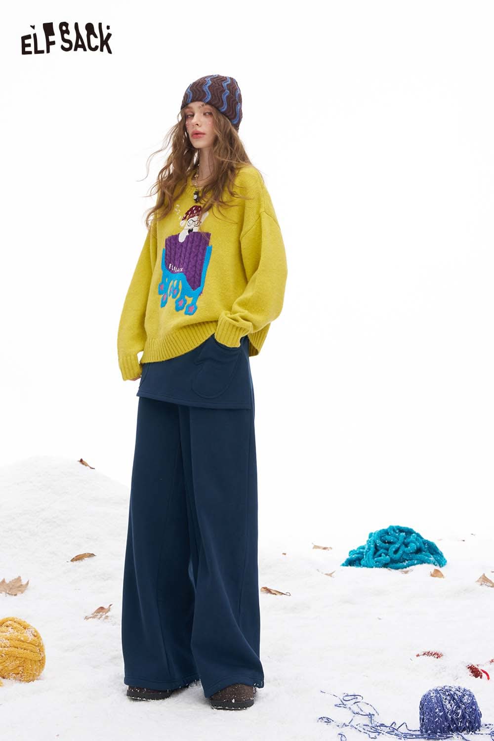 ELFSACK women's floor length wide leg pants paired with a colorful oversized sweater for a cozy winter look