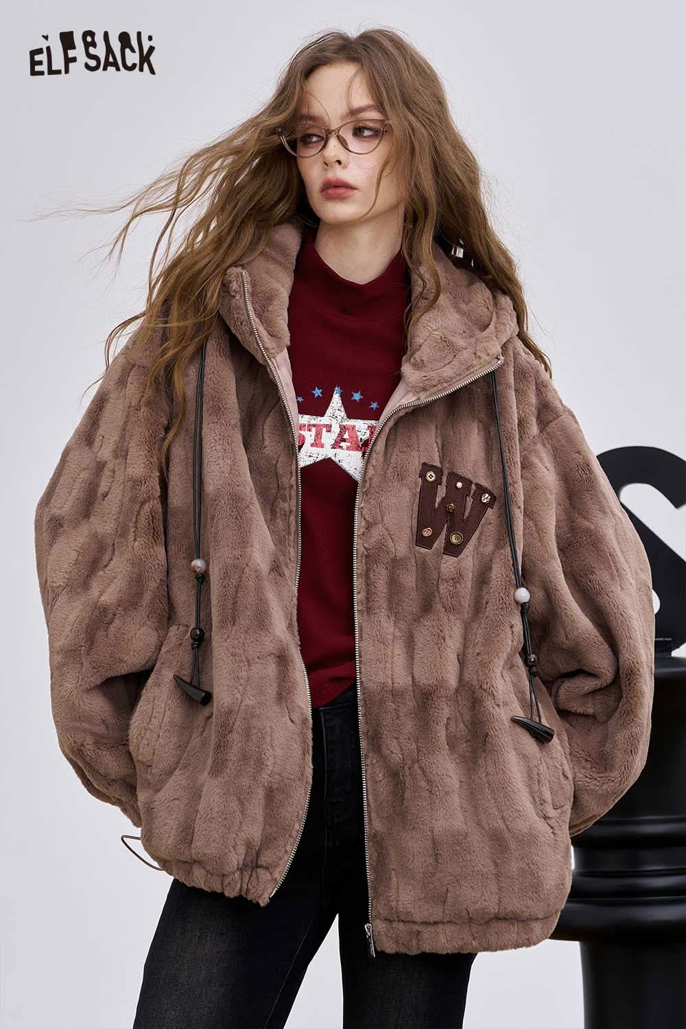 ELFSACK stylish women's graphic long sleeve t-shirt layered under a cozy brown jacket