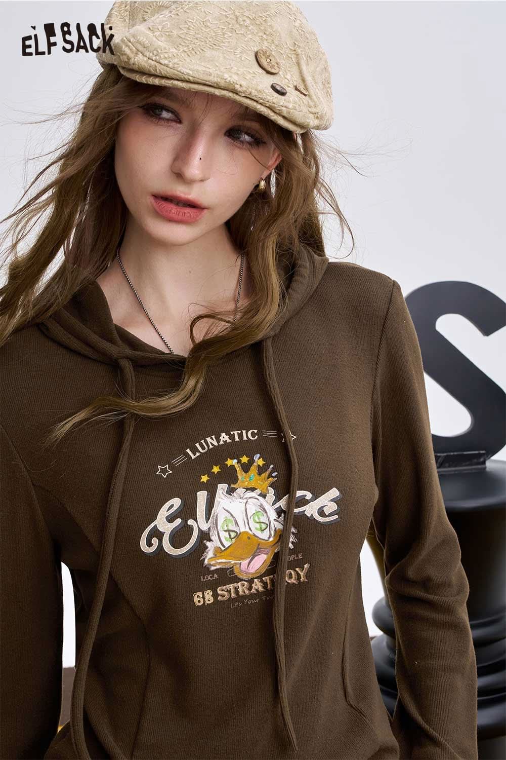 ELFSACK women's graphic long sleeve tshirt featuring a fun cartoon design for casual wear