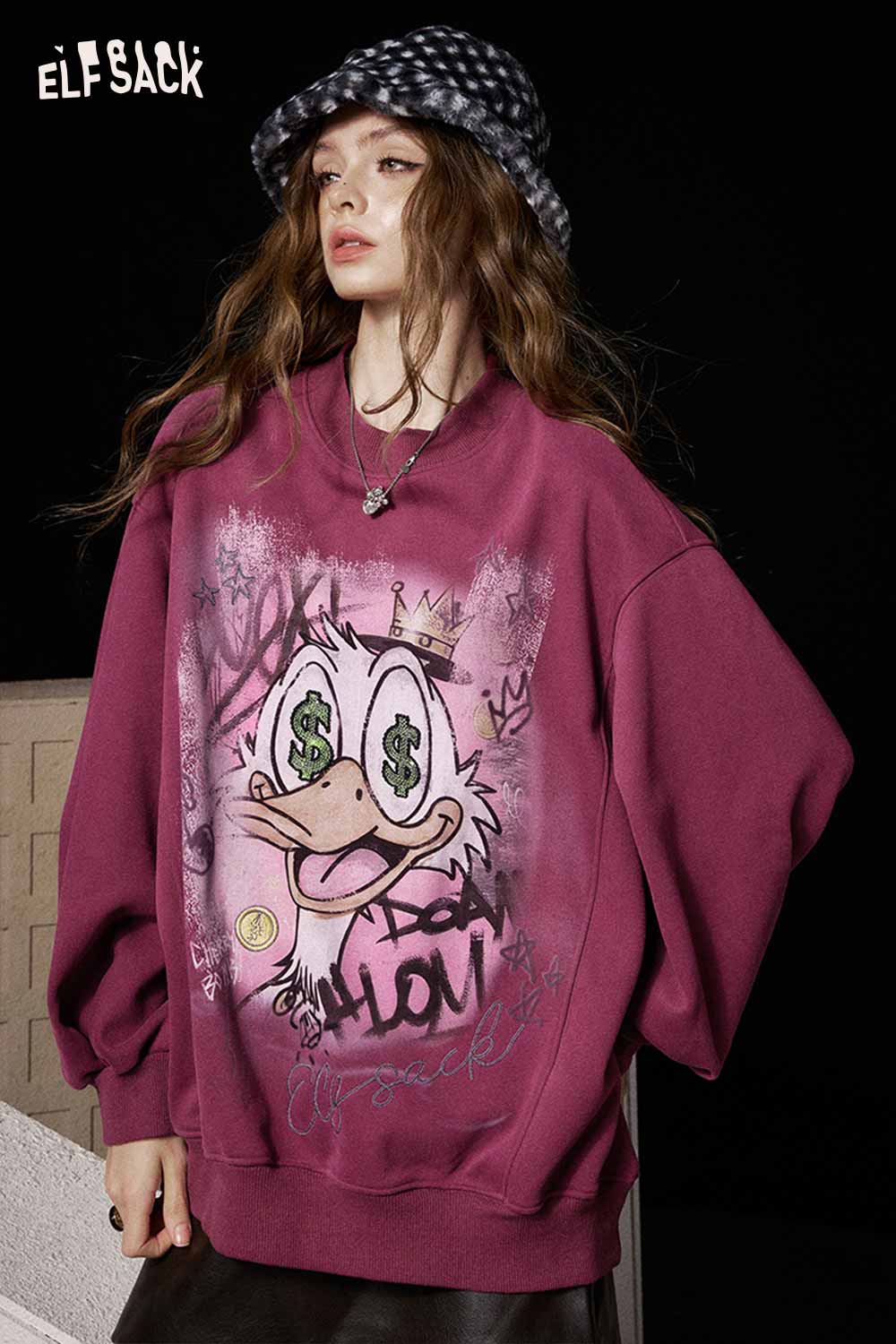 ELFSACK women's graphic long sleeve tshirt in burgundy featuring a cartoon design and oversized fit