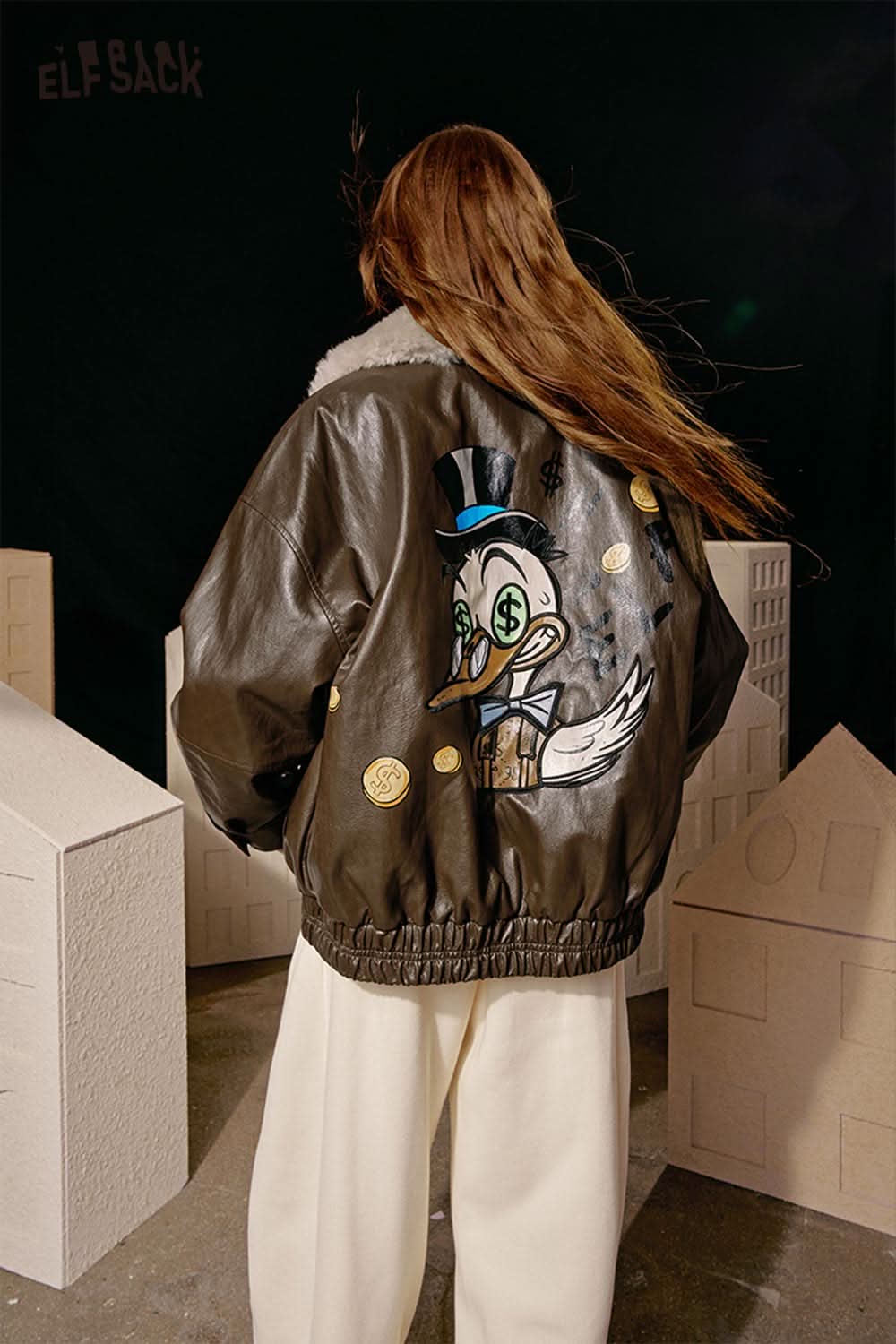ELFSACK women's graphic plush leather jacket featuring a playful character design on the back