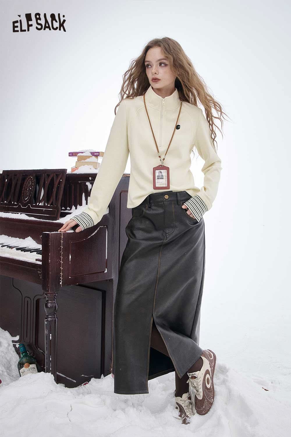 ELFSACK women's half zip high neck t-shirt in cream, styled with a leather skirt for a chic winter look