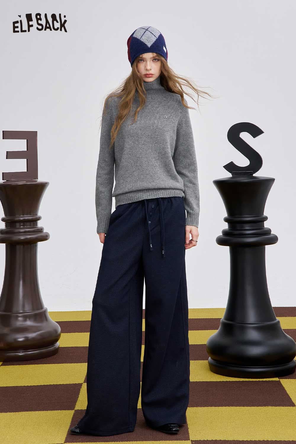 ELFSACK women's high neck knit sweater in grey, styled with wide-leg pants and a trendy beanie