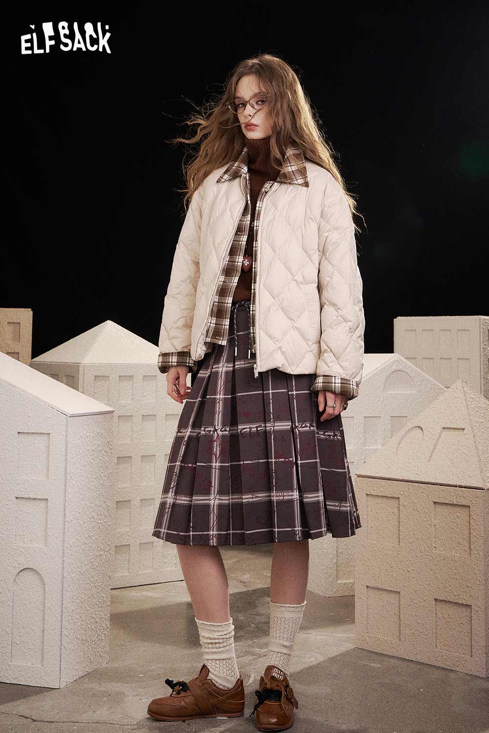 ELFSACK women's high neck knit sweater layered under a quilted jacket in a stylish outfit