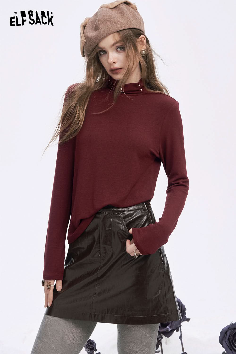 ELFSACK women's high neck pearl t-shirt in burgundy paired with a shiny black skirt for a stylish look