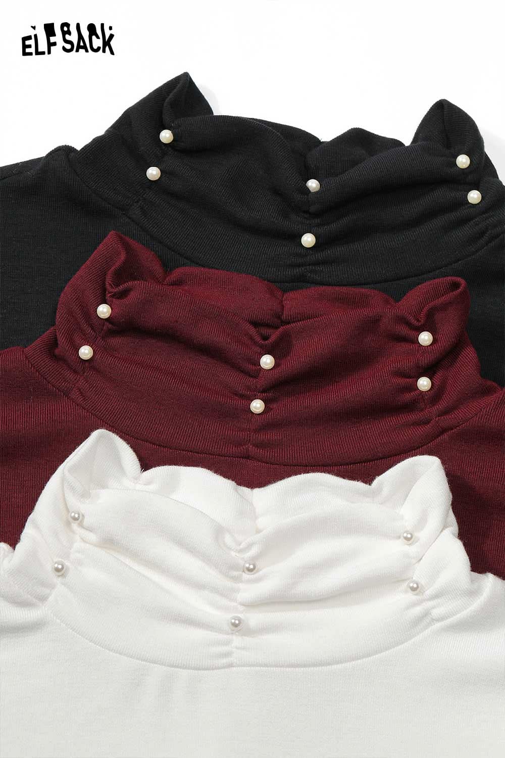 Women's high neck pearl t-shirt in black, burgundy, and white showcasing elegant pearl detailing