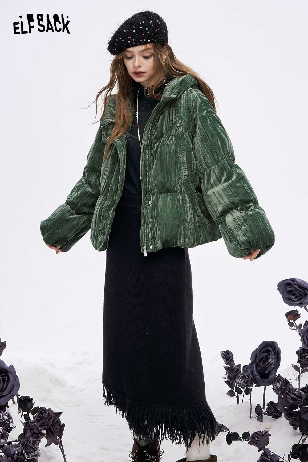 ELFSACK women's high neck pearl t-shirt styled under a green puffer jacket with a black skirt