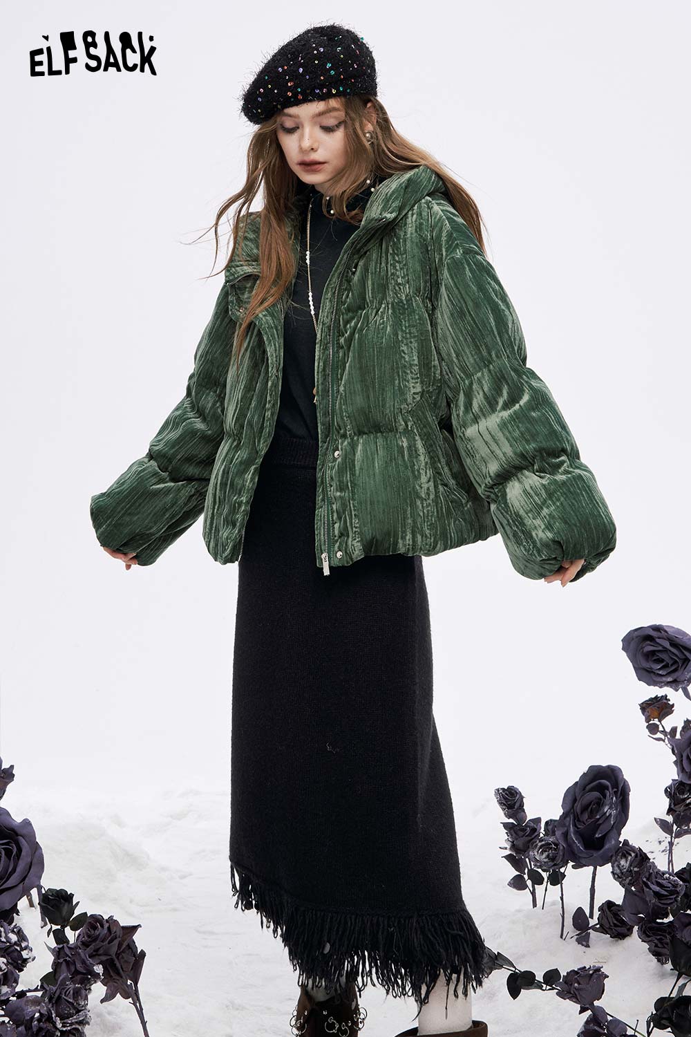 ELFSACK women's high neck pearl t-shirt styled under a green puffer jacket with a black skirt