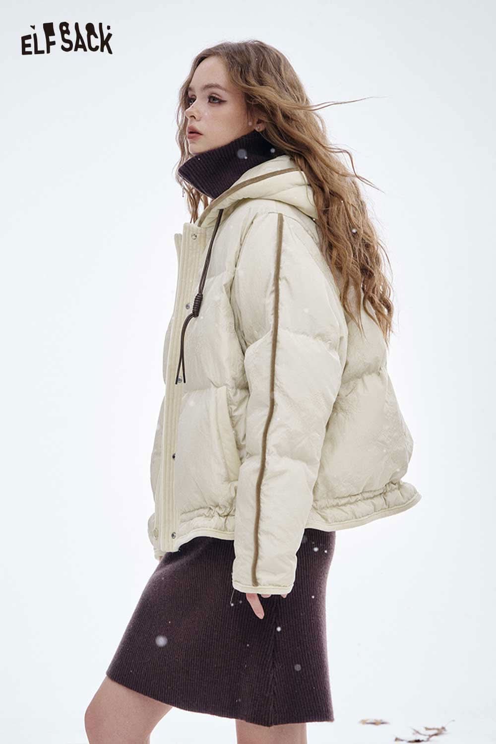 ELFSACK women's hooded down jacket in cream color, styled with a chic outfit for winter fashion