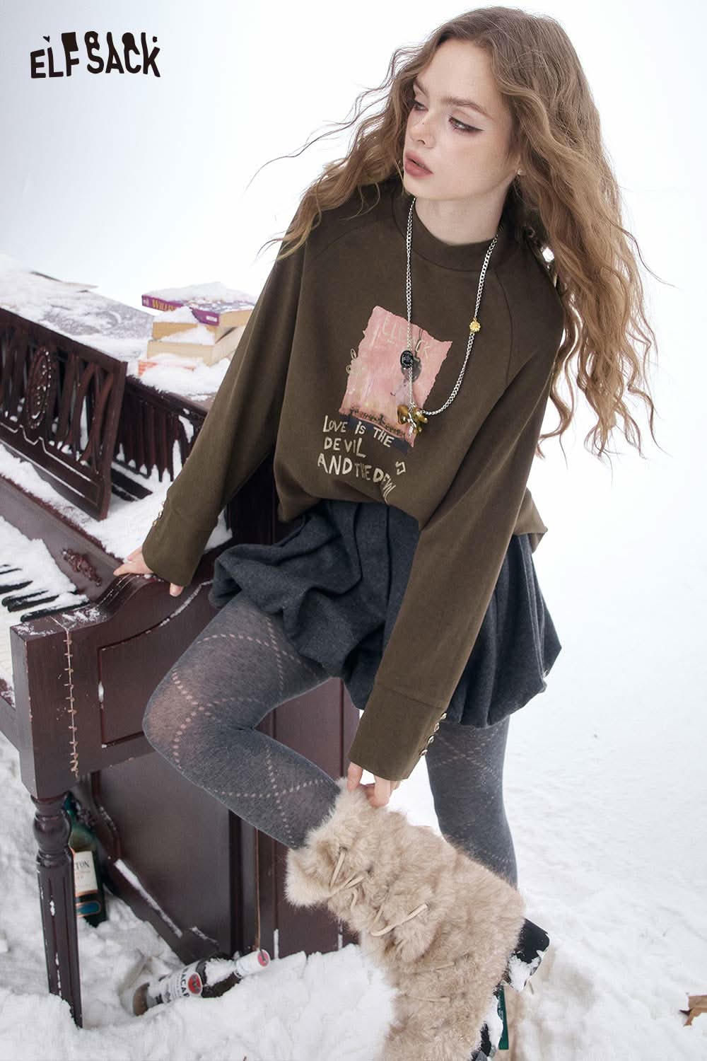 ELFSACK women's letter graphic long sleeve t-shirt styled with a cute skirt and winter accessories