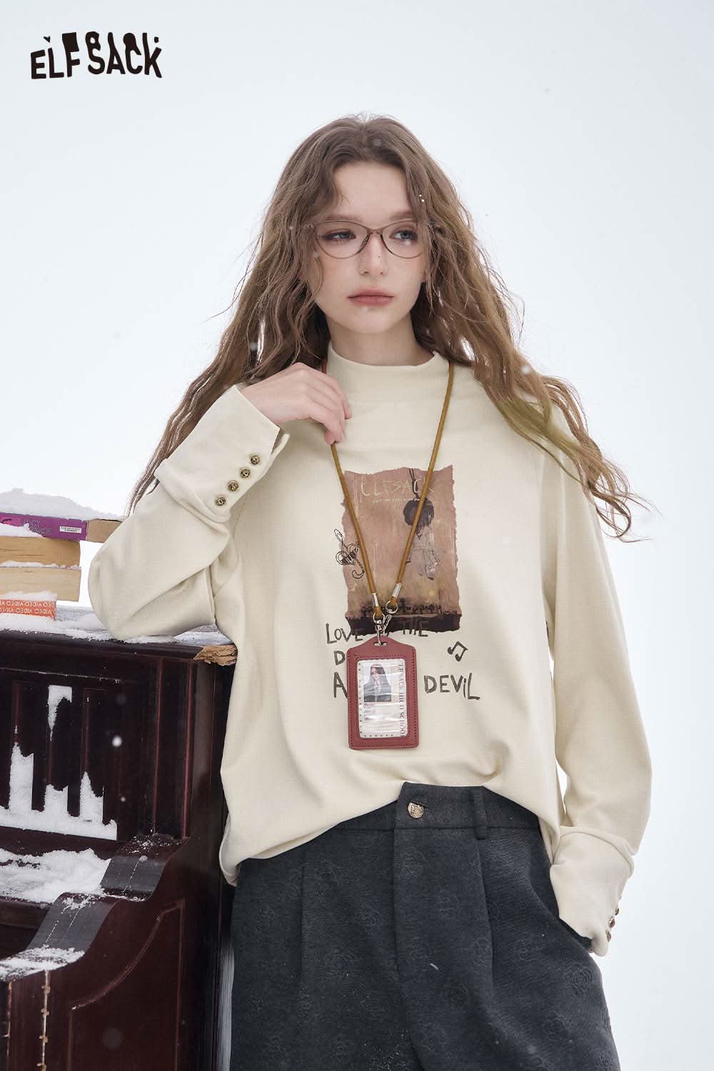 ELFSACK women's letter graphic long sleeve t-shirt in cream with stylish print for casual wear