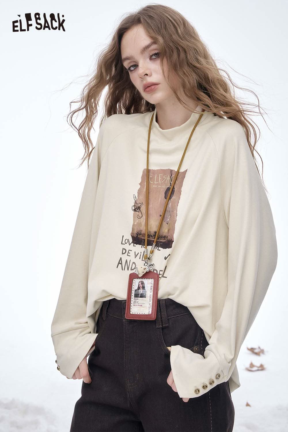 ELFSACK women's letter graphic long sleeve t-shirt in cream with unique design and relaxed fit