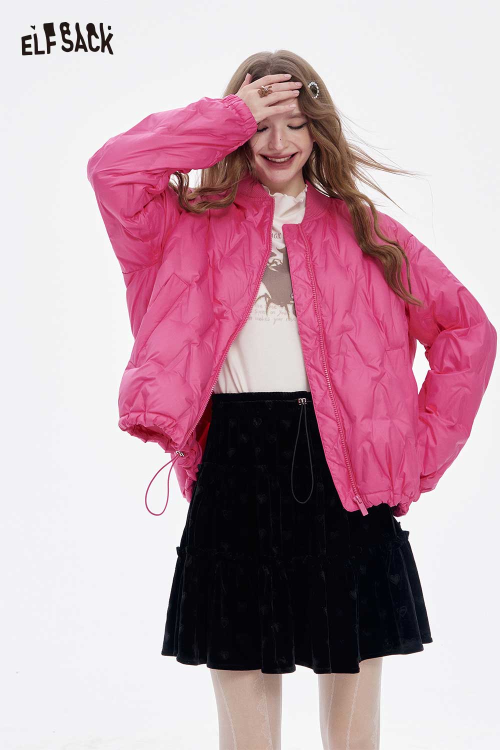 ELFSACK women's light down jacket in vibrant pink, styled with a white graphic tee and black skirt