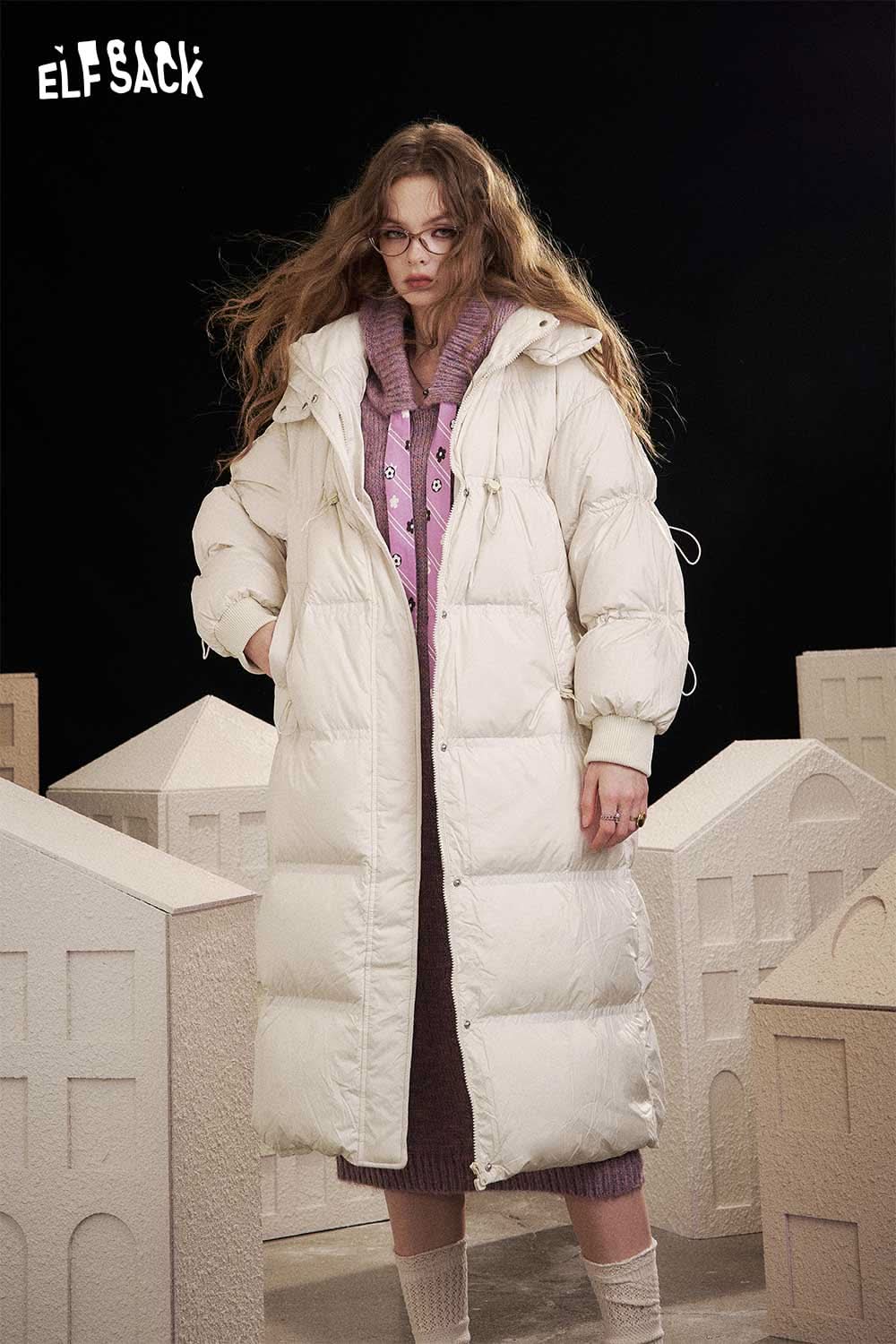 ELFSACK women's long down coat with hood in cream color, featuring a stylish puffy design and adjustable drawstrings