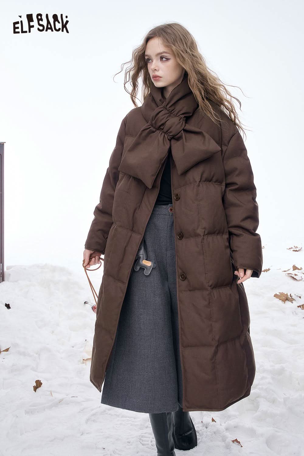 ELFSACK women's long down jacket with scarf in brown, featuring a stylish bow detail and button closure.