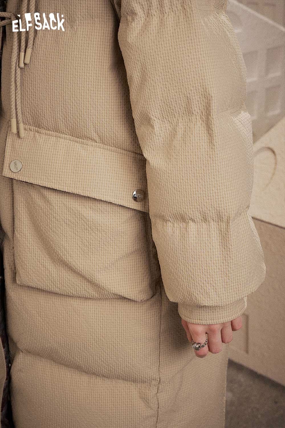 Close-up of ELFSACK women's long toggle button jacket in beige with a textured pattern