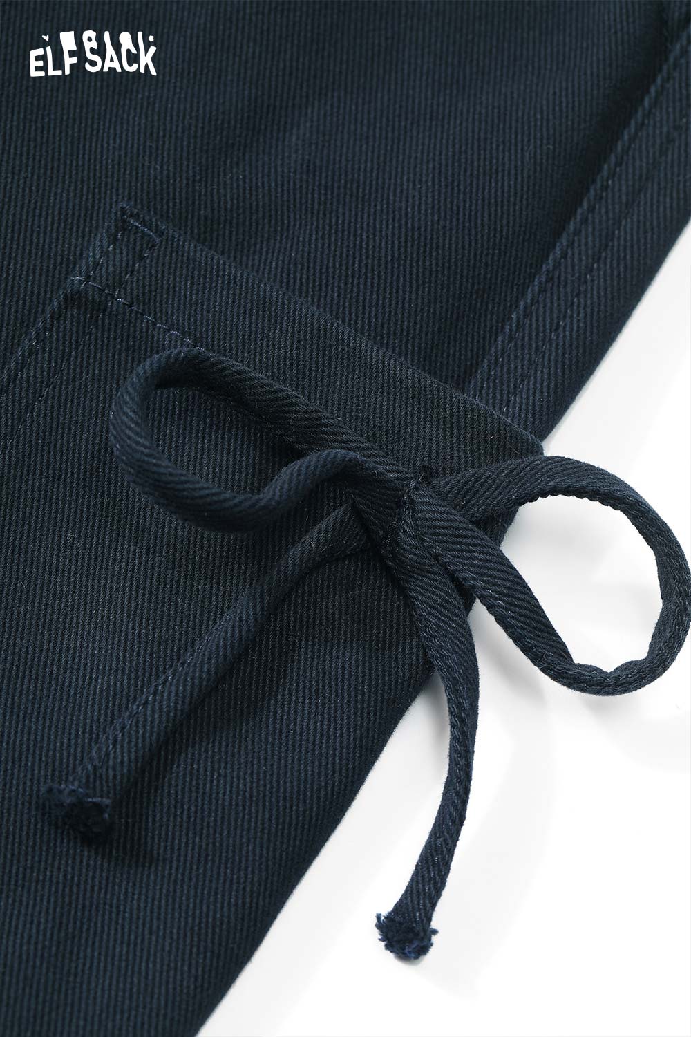 Close-up of ELFSACK women's loose cargo pants with drawstring detail and textured fabric