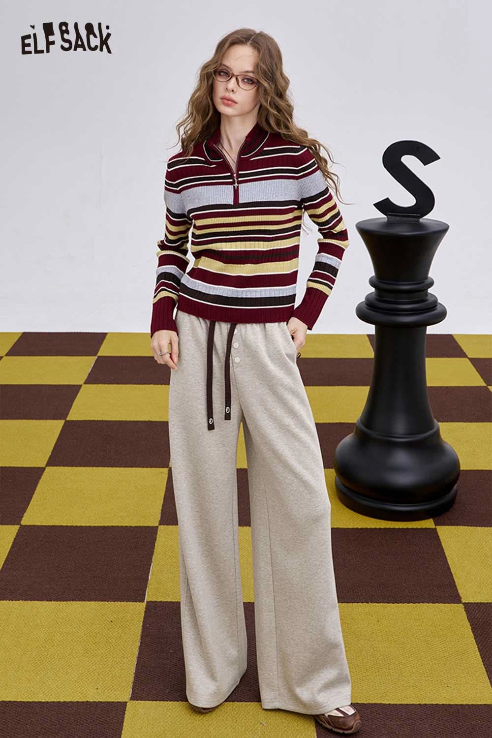 ELFSACK women's loose drawstring pants in beige paired with a striped sweater for a casual look