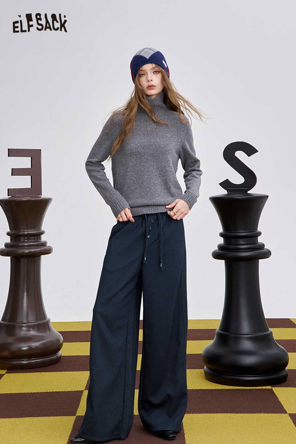 ELFSACK women's loose drawstring pants styled with a gray sweater in a playful setting