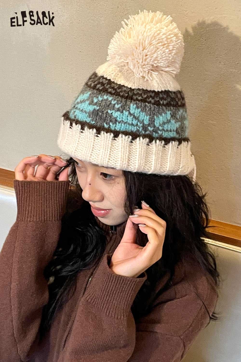 ELFSACK women's patchwork knit hat with pom pom and cozy winter design on a model