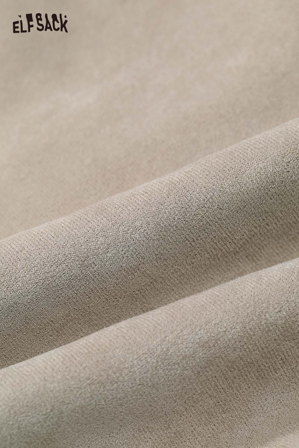 Soft fabric texture of an ELFSACK women's plush lapel short coat in a neutral tone