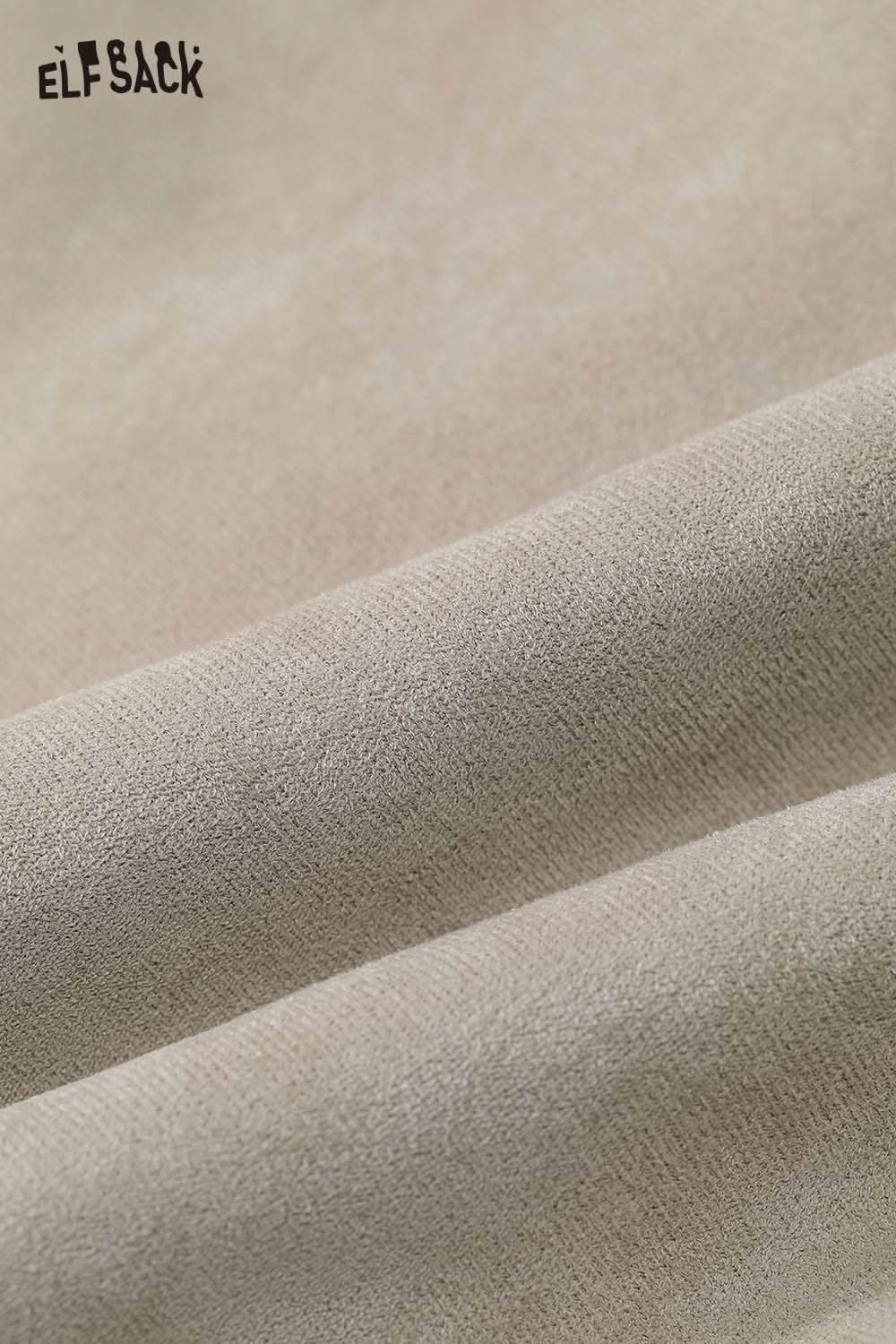 Soft fabric texture of an ELFSACK women's plush lapel short coat in a neutral tone