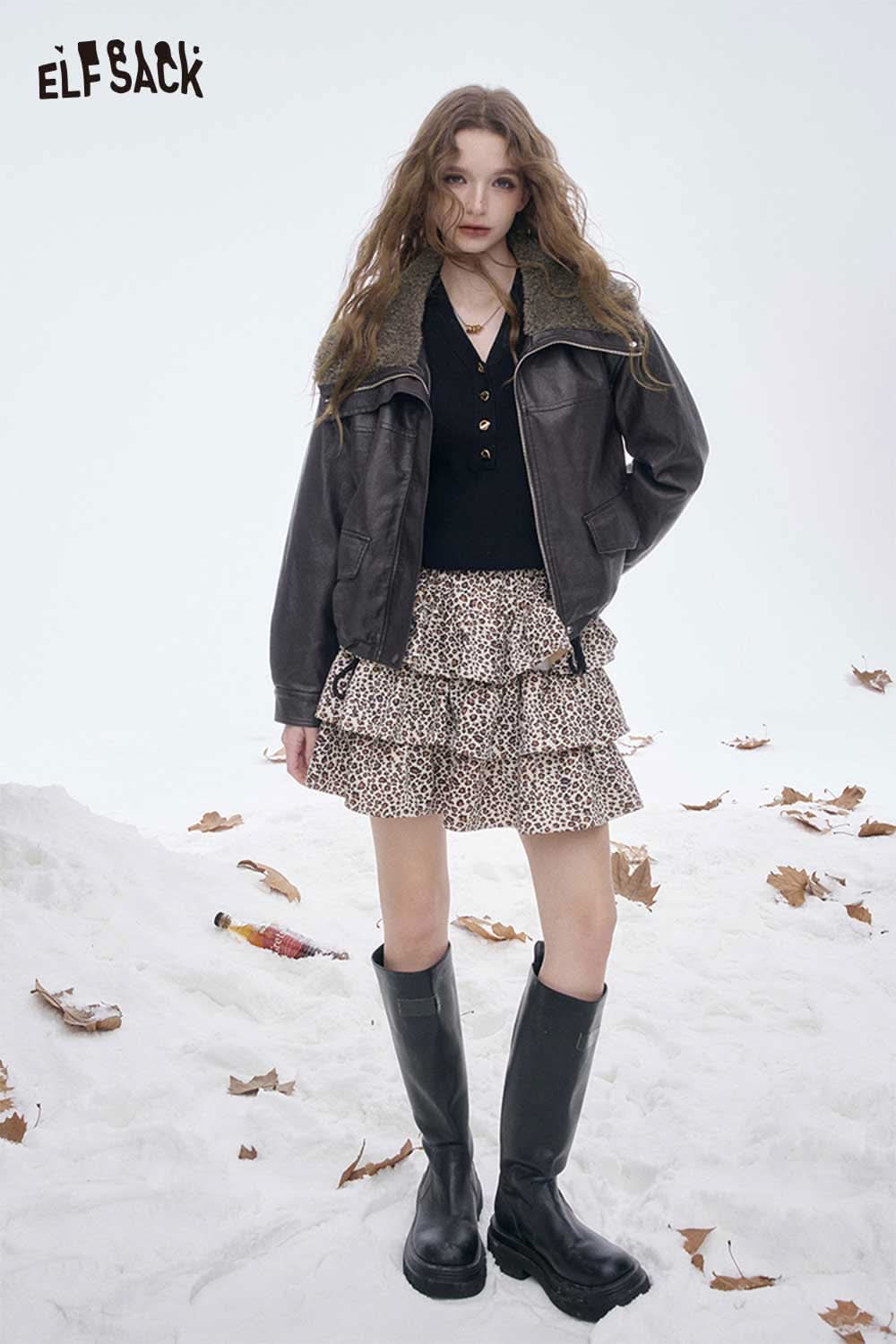 ELFSACK women's plush lined leather jacket styled with a skirt and knee-high boots in a winter setting
