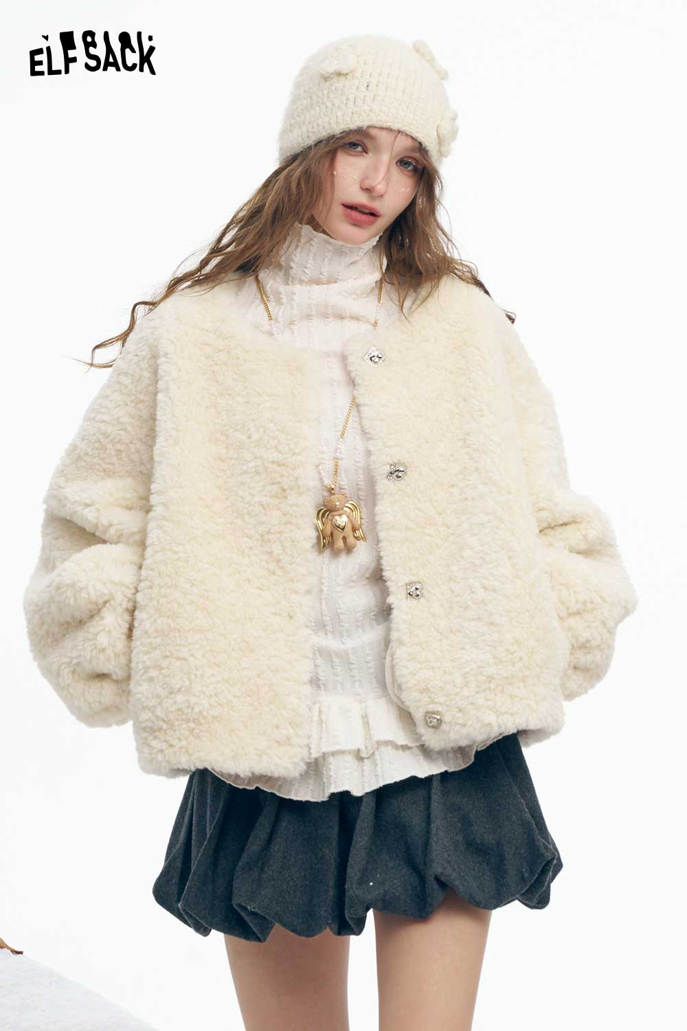 ELFSACK women's plush short coat in cream with oversized sleeves, layered over a white sweater and skirt